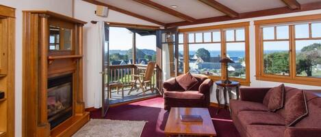 Luxury Suite, 1 King Bed | Living room | Flat-screen TV, fireplace