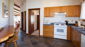 Luxury Suite, 1 King Bed | Private kitchen | Fridge, microwave, oven, stovetop