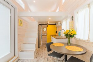 Cabin (Tiny House - Yellow Lifeguard Stand) | Living area | Flat-screen TV, Netflix, streaming services - Tiny House Siesta (Sarasota)