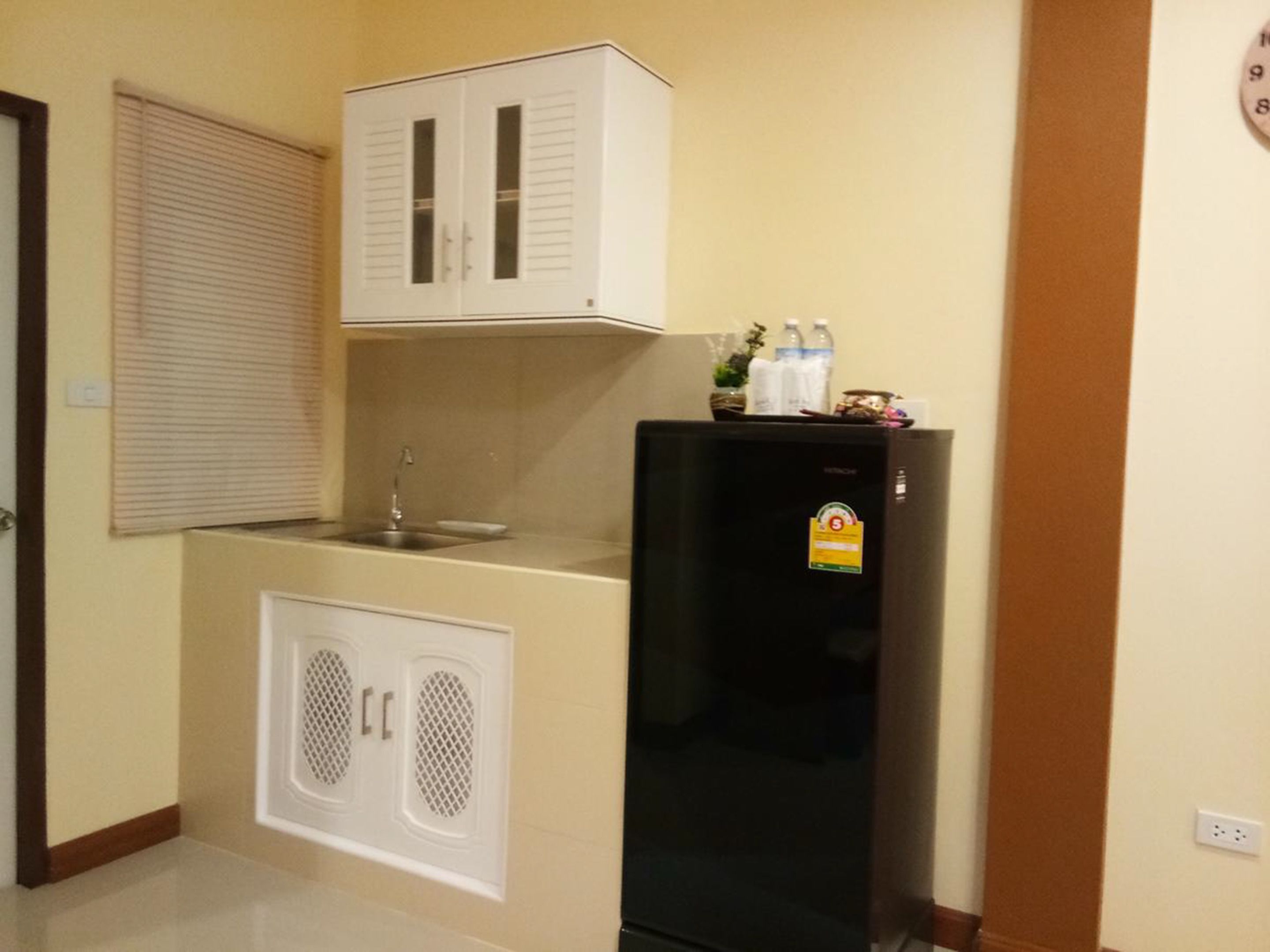 fridge, electric kettle, cookware/dishes/utensils