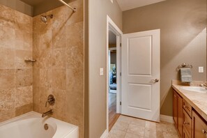 Bathtub, hair dryer, towels, soap