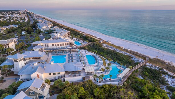 An aerial view of a resort with multiple swimming pools, beachfront access, and a variety of buildings. - Modern Luxury Oasis: Outdoor Fire Pit Overlooking Camp WaterColor Pool and Park. (Santa Rosa Beach)