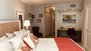 A neatly arranged bedroom with a bed, a desk, and a chair. - PARADISE-Anglers Cove Waterfront Designer Condo (Marco Island)