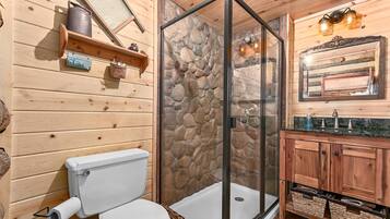Shower, hair dryer, towels, shampoo