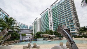 Outdoor pool, open 6 AM to 7 PM, pool umbrellas, sun loungers - iRise at Azure Urban Resort Residences (Parañaque)