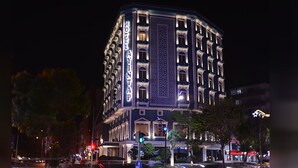 A multi-story hotel with a classic architectural design, featuring a prominent entrance and multiple windows. - Ayintap Hotel (Gaziantep)