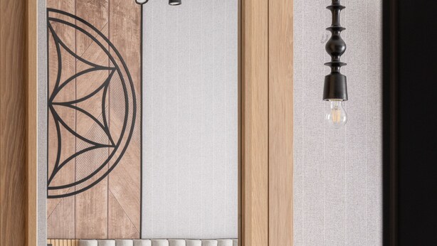 Et moderne soveværelse med seng, natbord og en hængende lampe.
