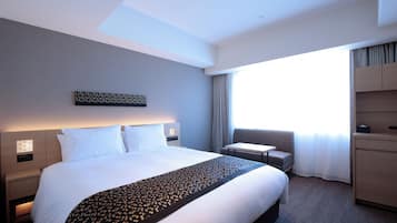 Premium bedding, down duvets, in-room safe, desk