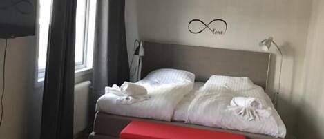 Family Room | 1 bedroom, premium bedding, minibar, in-room safe