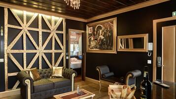 Deluxe Suite, City View | Living area | 43-inch flat-screen TV with cable channels, TV