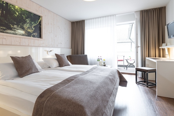 Superior tweepersoonskamer | Een bureau, verduisterende gordijnen, geluiddichte muren