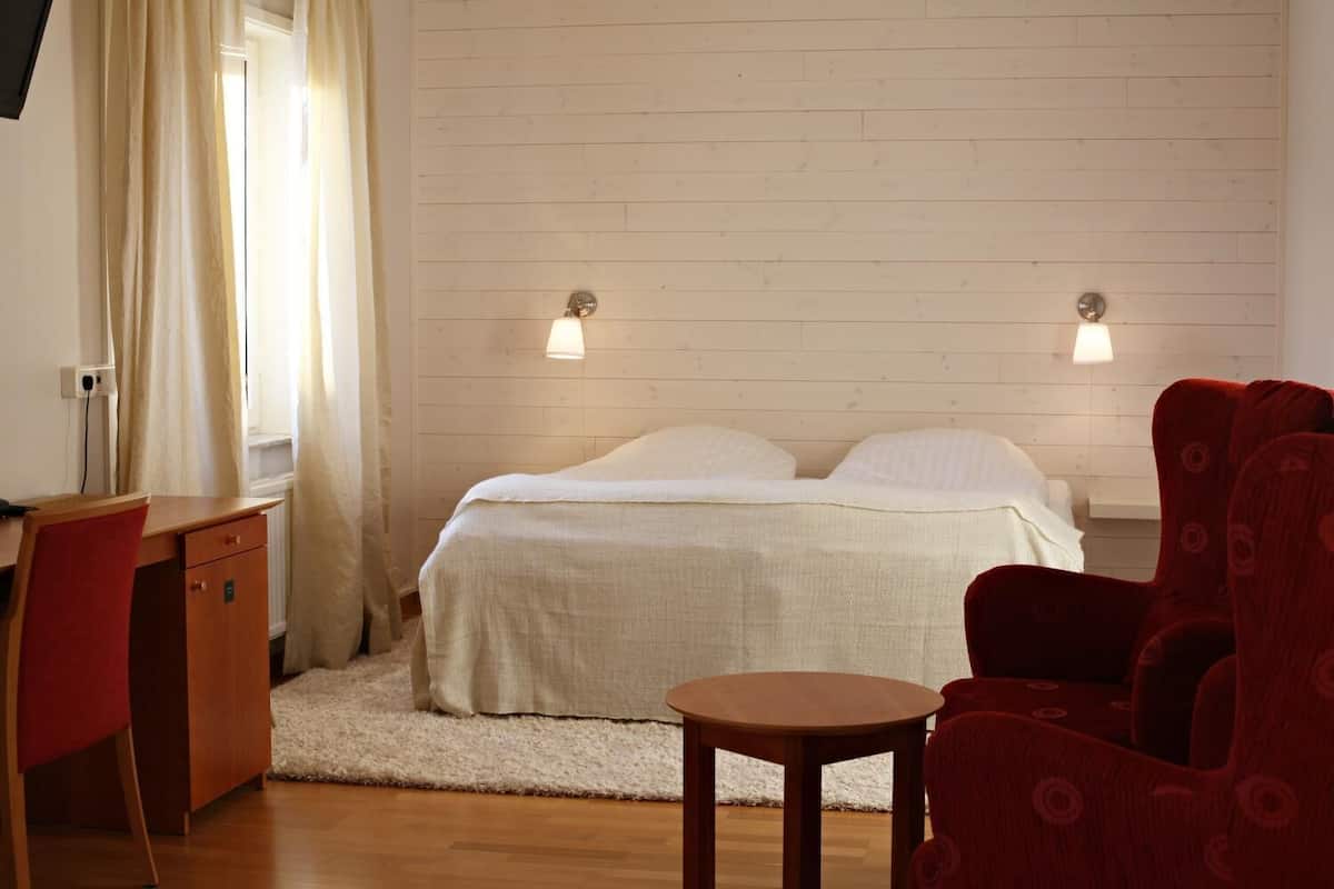 family room | premium bedding, desk, blackout curtains, iron/ironing board