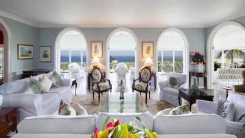 Room, 4 Bedrooms | Living area | Flat-screen TV