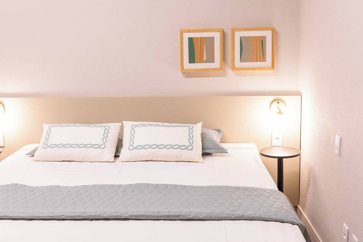 Luxury Triple Room | Minibar, desk, laptop workspace, blackout drapes