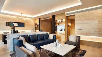 Premier Suite, 1 Bedroom | Living room | 55-inch LED TV with cable channels, TV