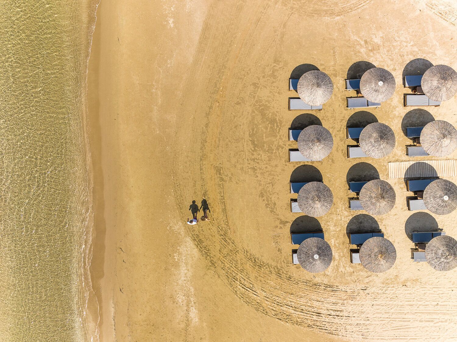 On the beach, sun-loungers, beach umbrellas, beach towels