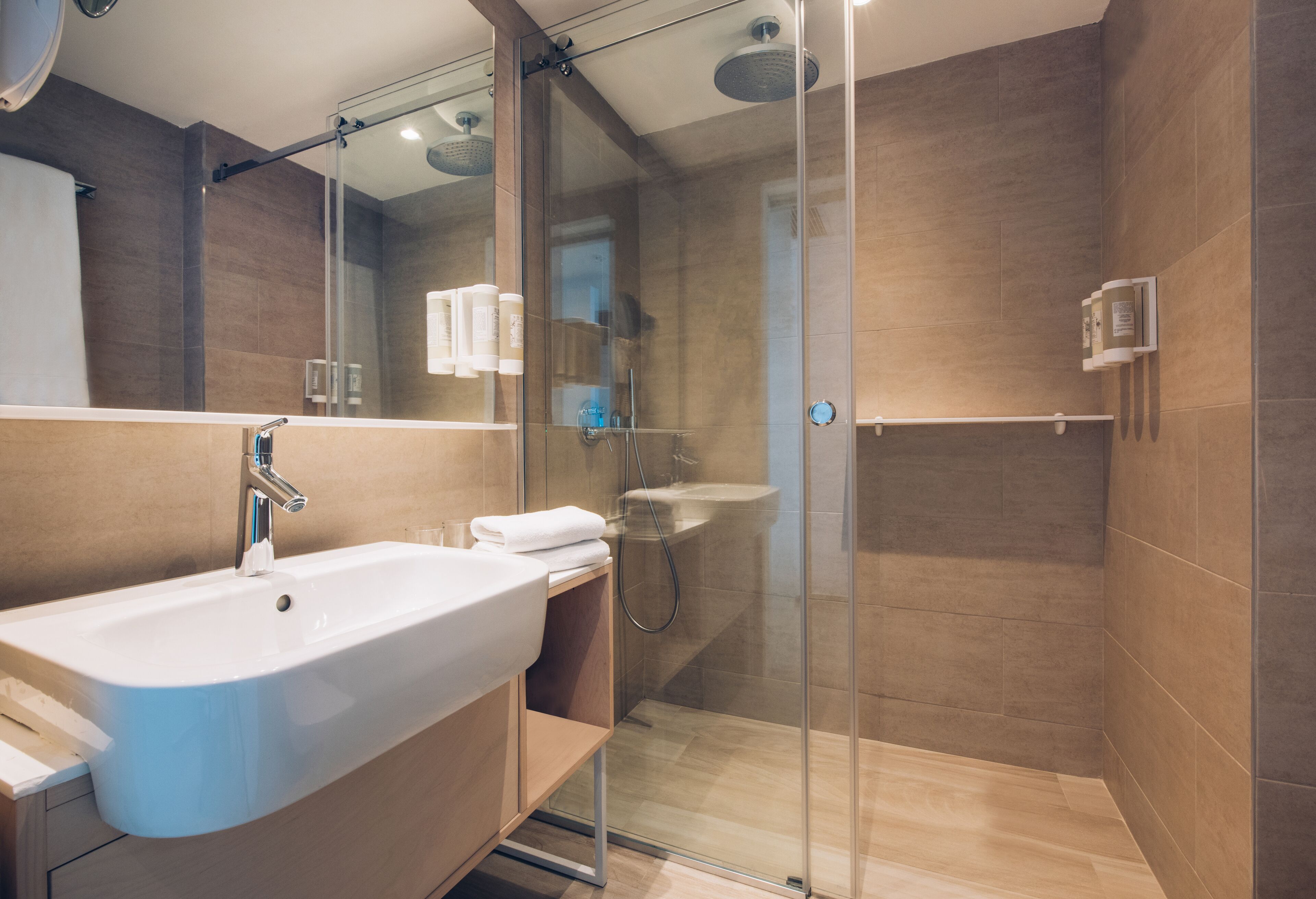 eco-friendly toiletries, hair dryer, towels