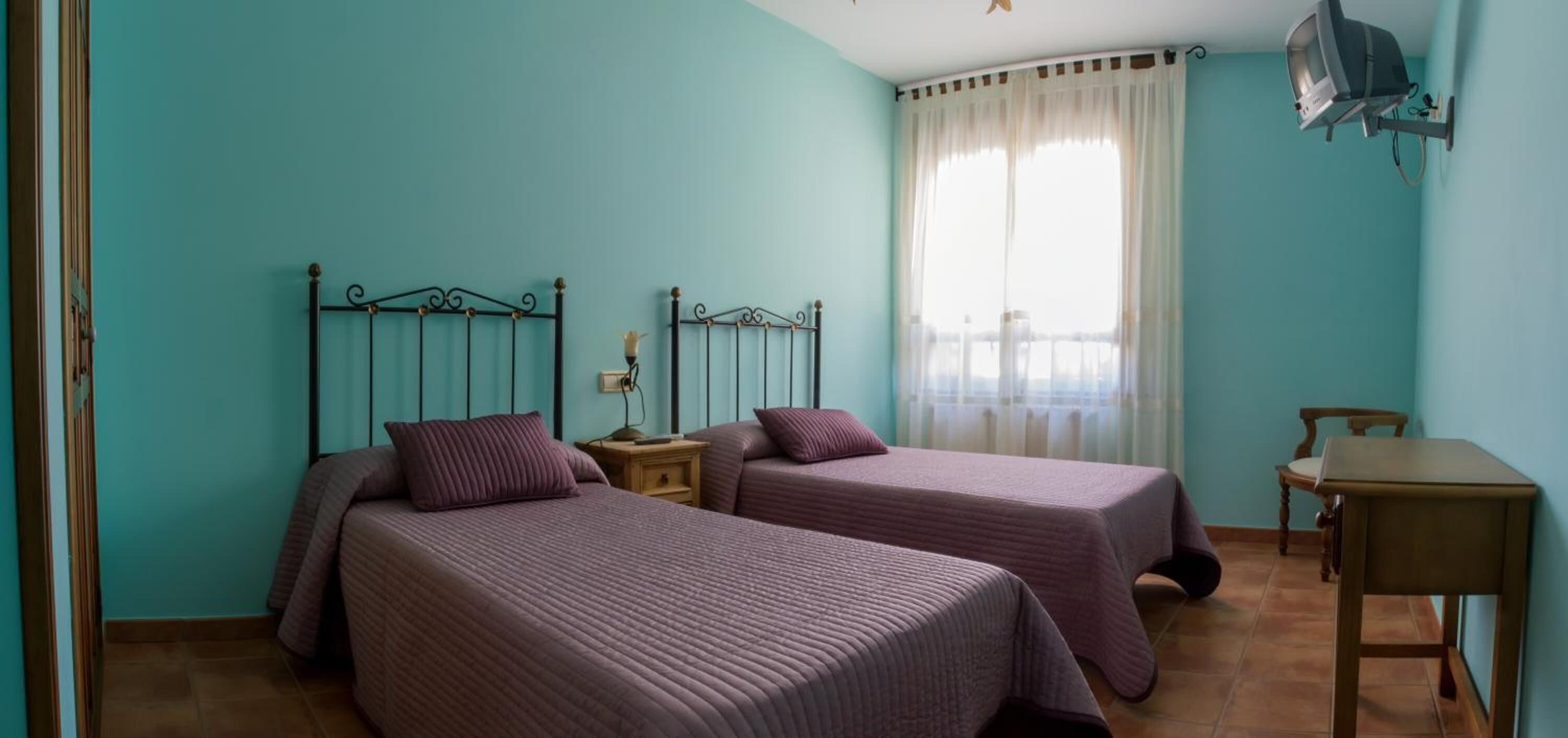 desk, blackout curtains, iron/ironing board, free cots/infant beds