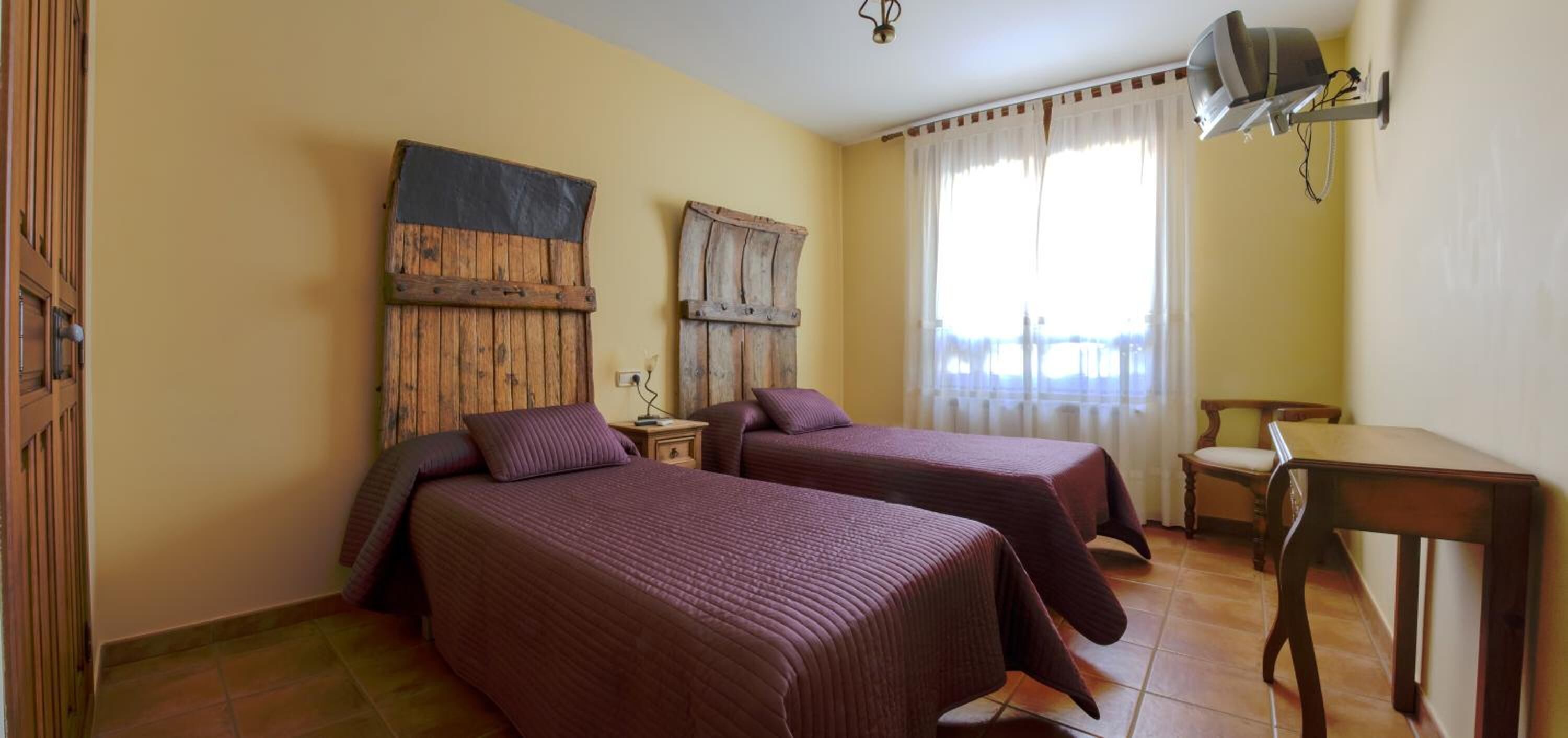 desk, blackout curtains, iron/ironing board, free cots/infant beds