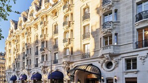 A historic building with ornate architectural details, multiple balconies, and a classic entrance with a canopy. - Mandarin Oriental Lutetia, Paris (Paris)