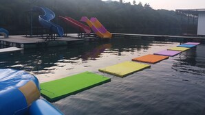 A water park with slides and floating platforms. - Ingphupha Resort and Restaurant (Si Sawat)