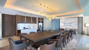 A modern kitchen with a large island, pendant lighting, and a marble backsplash. - Intercontinental Taiyuan by IHG (Taiyuan)