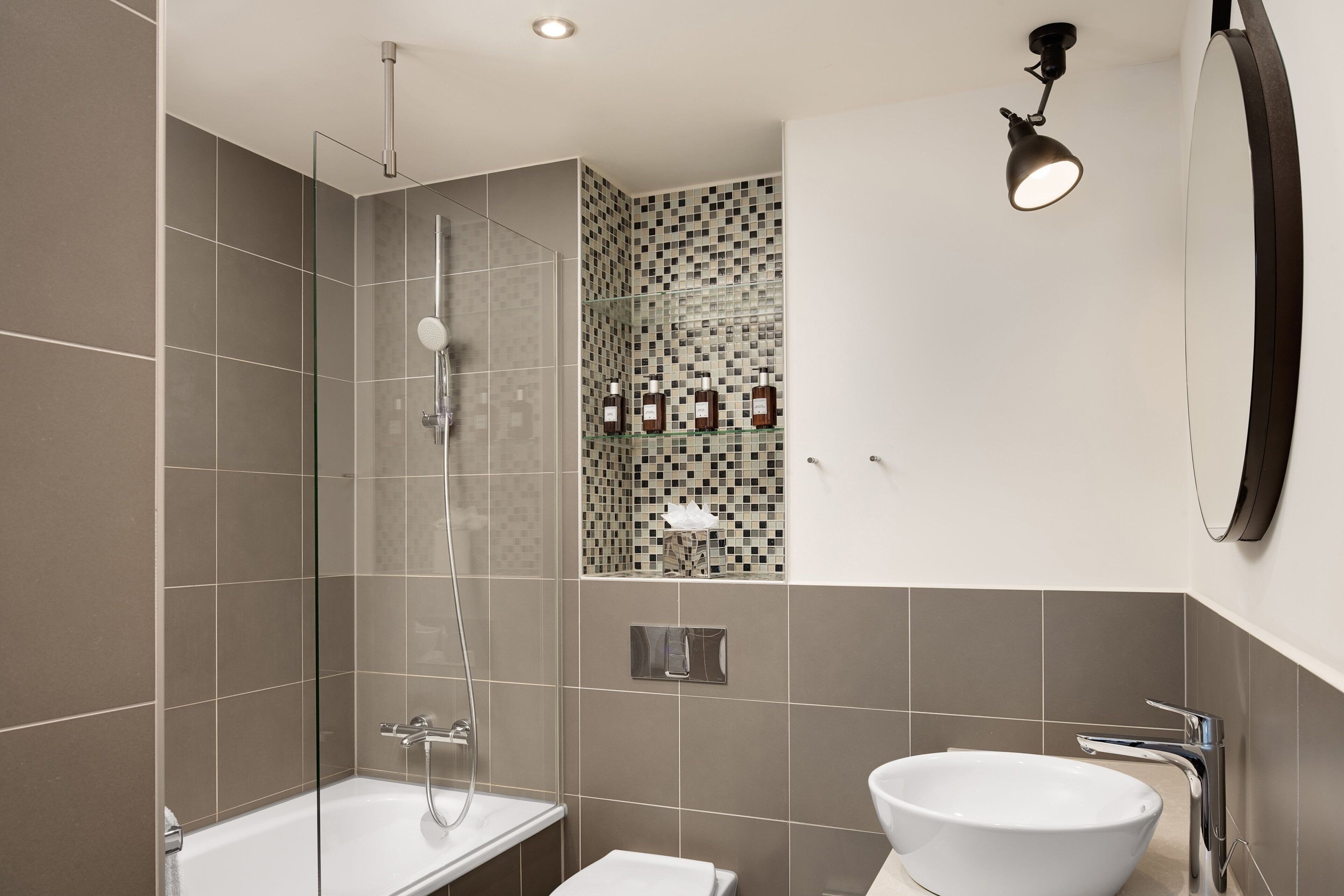 suite, 1 queen bed, corner | bathroom | free toiletries, hair dryer, towels, toilet paper