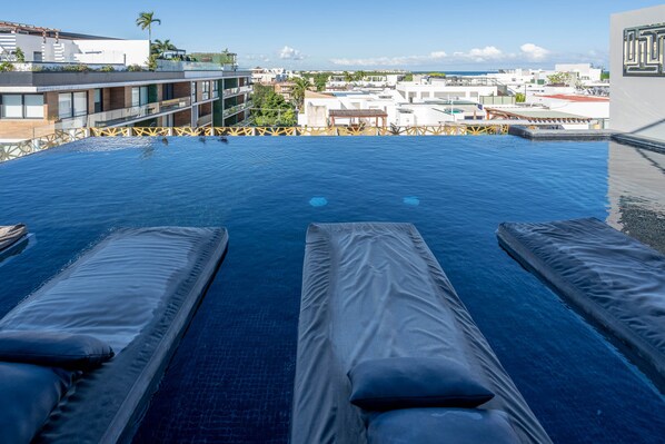 Outdoor pool, open 9:00 AM to 9:00 PM, pool loungers