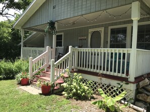 A house with a porch, steps, and a welcome sign. - Cute Cottage, Pet and Family Friendly, Reduced Rates for  Longer Term Rentals (Black Mountain)