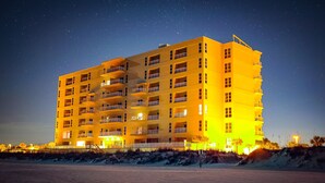 A multi-story hotel with balconies, located near a beach. - Spectacular Beach Front Views!  Free Lazy Days Beach Chairs & Umbrella Included! (Pensacola Beach)