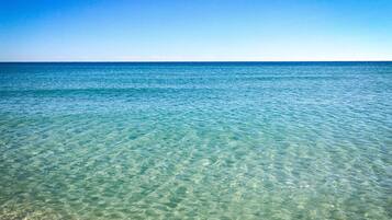 On the beach, sun loungers