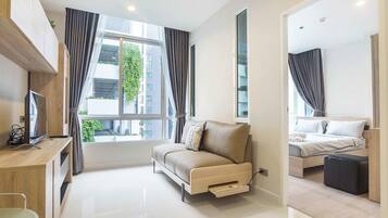 Standard Apartment, 1 Bedroom | Living area | Flat-screen TV