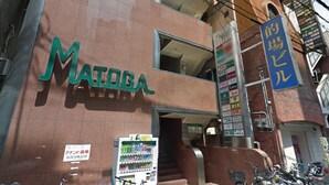 A building with a sign reading "MATODA". - Matoba biru (Osaka)