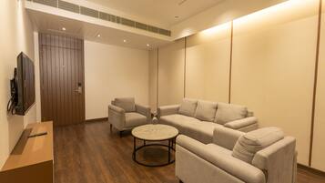 Luxury Room | Living area | Flat-screen TV