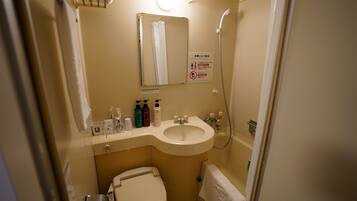 Combined shower/tub, free toiletries, hair dryer, slippers