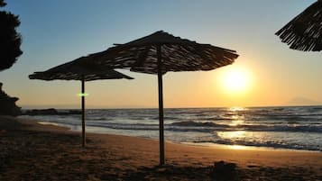 On the beach, sun-loungers