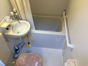 A bathroom with a sink, faucet, and a bathtub. - Yanaka No Taisuke (Gujo)