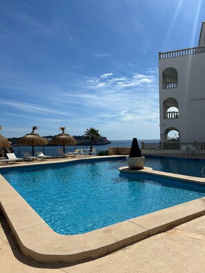 Seasonal outdoor pool, open 8:00 AM to 8:00 PM, free pool cabanas