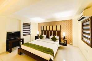 Deluxe Room, 1 Bedroom | Iron/ironing board, free WiFi - Treebo Paradise (Ahmedabad)