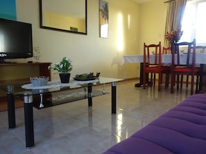 Comfort Apartment, 3 Bedrooms, Terrace | Living area | 32-inch flat-screen TV with cable channels, TV - Apartment Bougainvilliers (Grand-Baie)