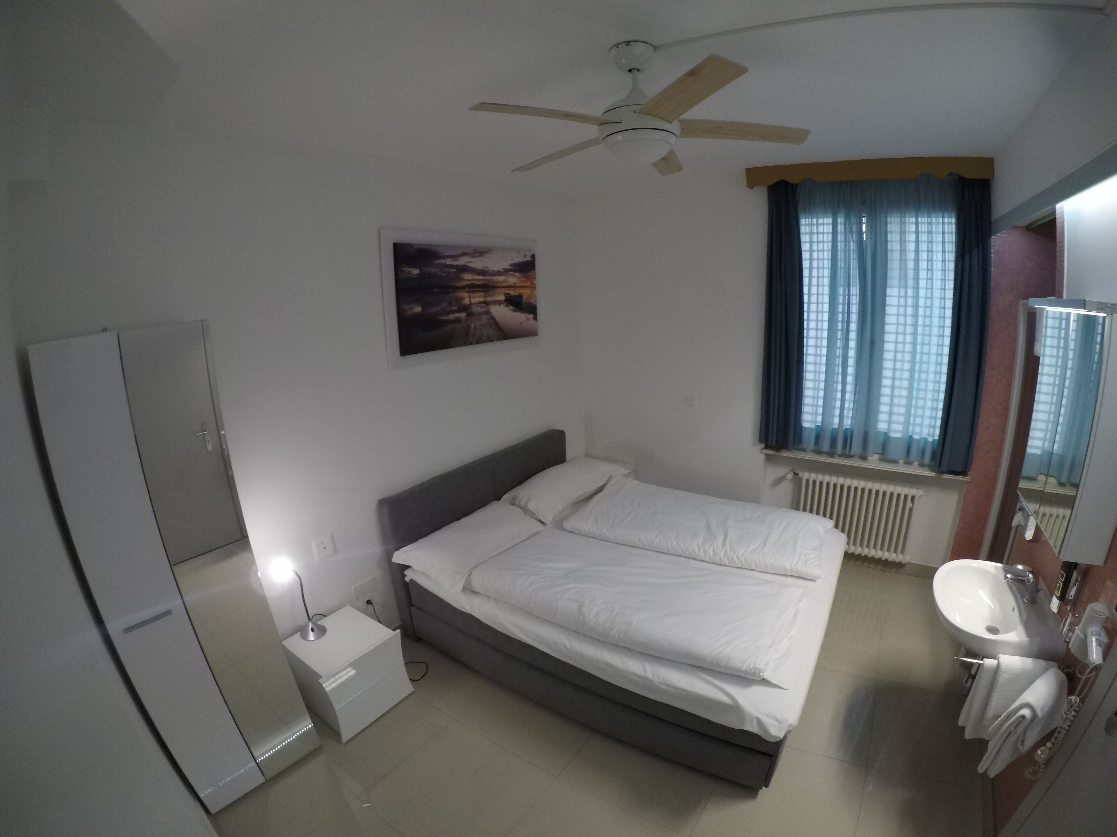 economy double room, shared bathroom | living area | 32-inch flat-screen tv with cable channels, tv