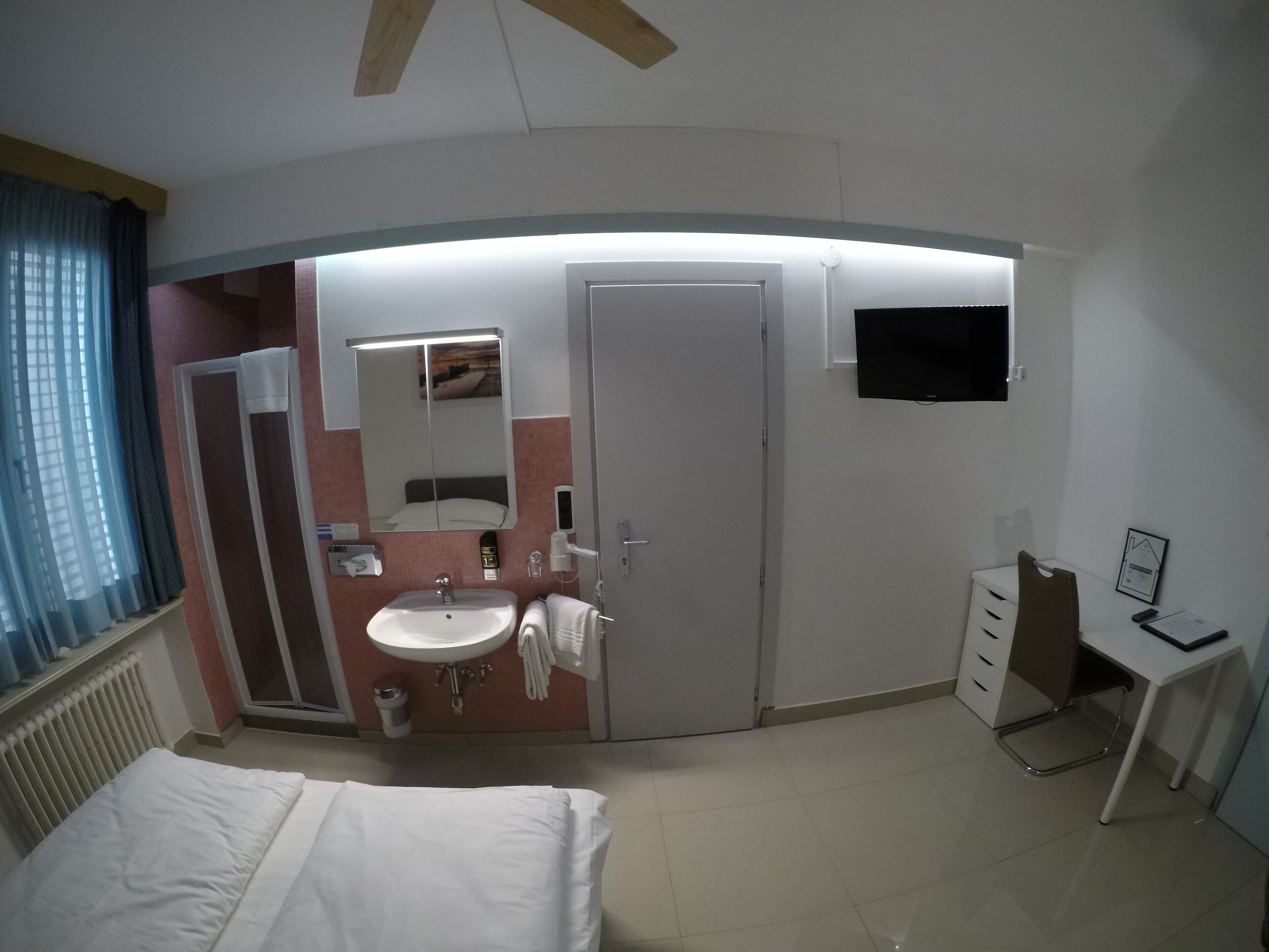 economy double room, shared bathroom | living area | 32-inch flat-screen tv with cable channels, tv