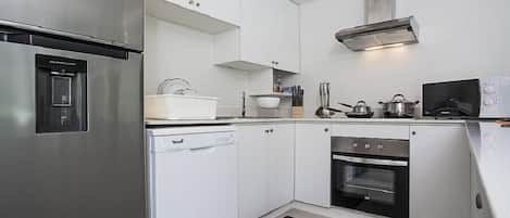 2-Bedroom Apartment | Private kitchen | Full-sized fridge, microwave, oven, stovetop