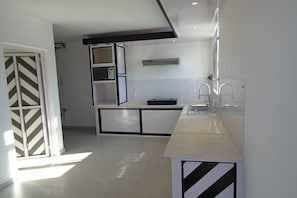 Family Apartment, 4 Bedrooms, Balcony, Poolside | Private kitchen | Full-size fridge, microwave, oven, stovetop - Twins Villa (Grand-Baie)