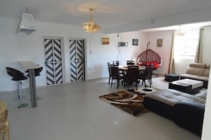 Family Apartment, 4 Bedrooms, Balcony, Poolside | Living area | 32-inch flat-screen TV with cable channels, TV - Twins Villa (Grand-Baie)