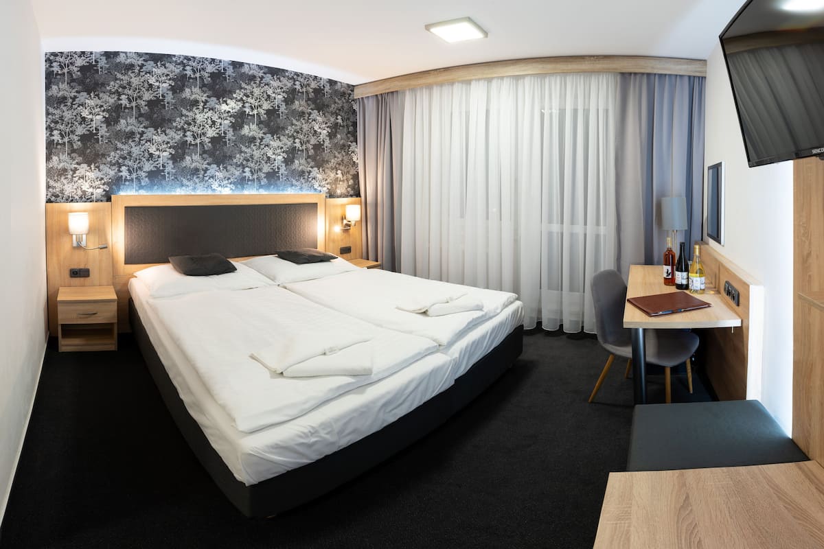 Classic Double or Twin Room | 2 bedrooms, in-room safe, desk, laptop workspace