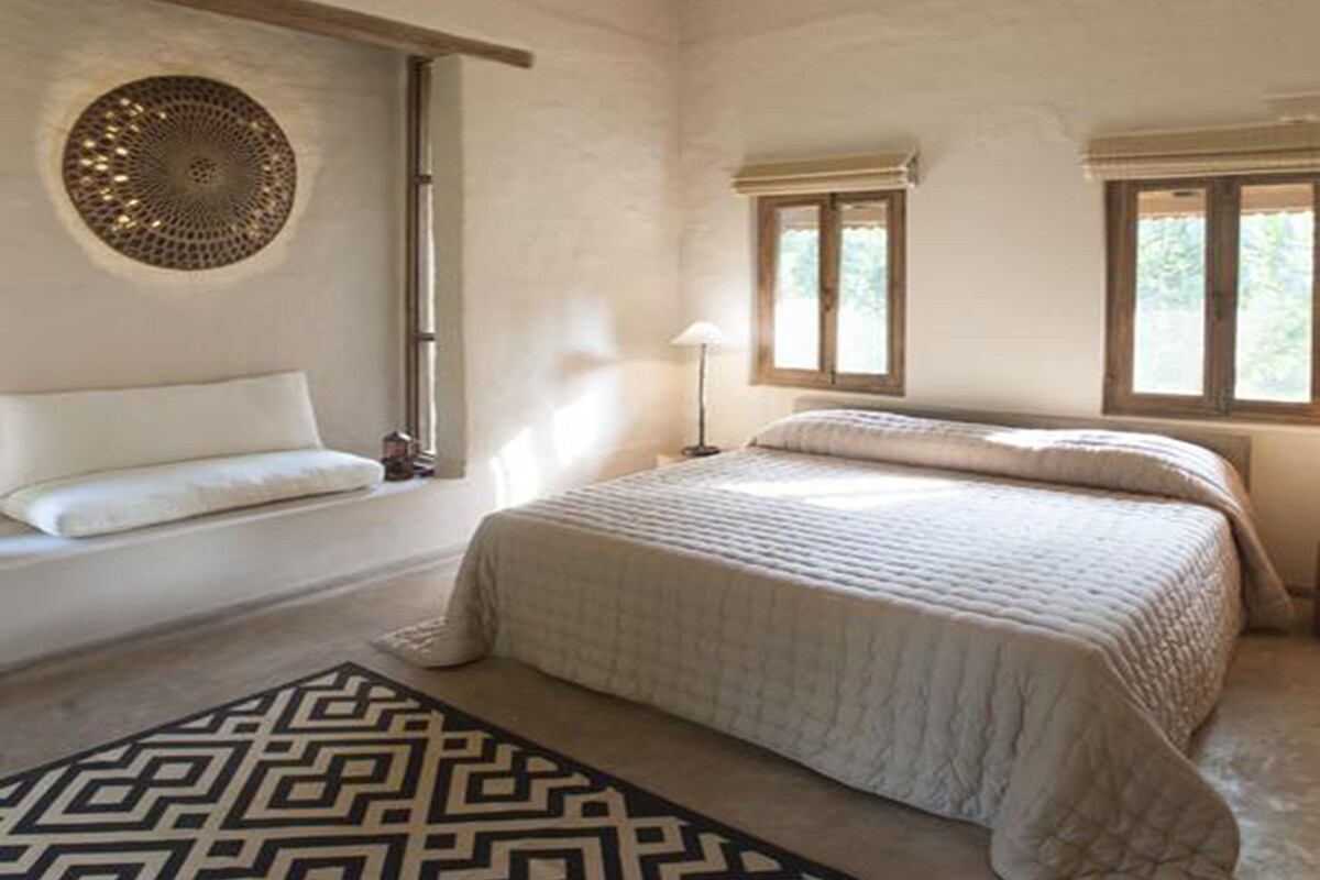 Premium bedding, desk, laptop workspace, soundproofing