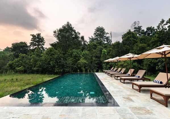 Seasonal outdoor pool, open 6:30 AM to 7:30 AM, pool umbrellas