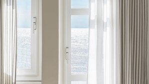 A view through a window with a view of a snowy landscape. - Hotel Riviera (Anzio)