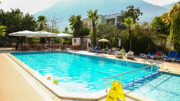 Seasonal outdoor pool, pool umbrellas, sun loungers